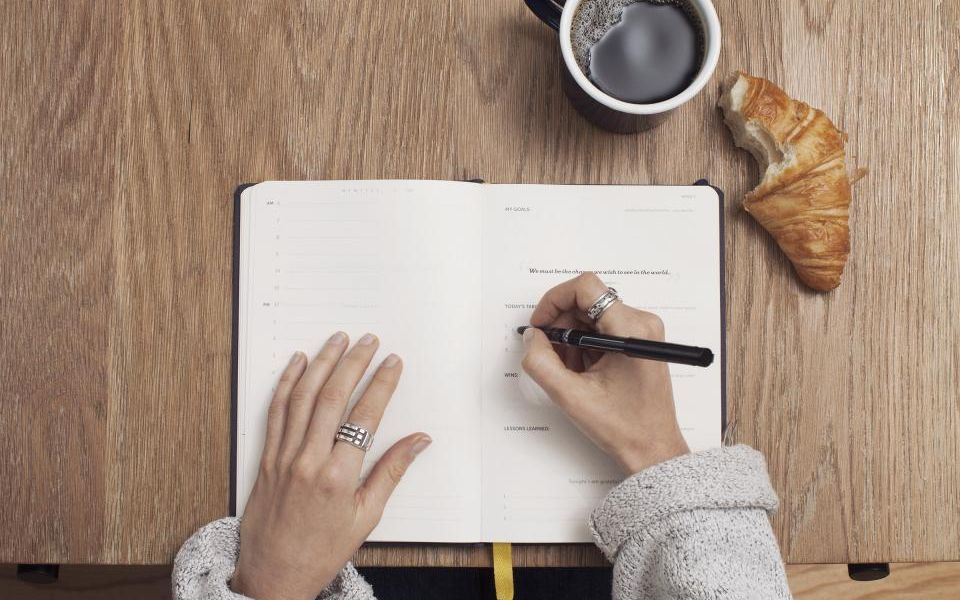 An open notebook and pen ready for a first Spanish lesson