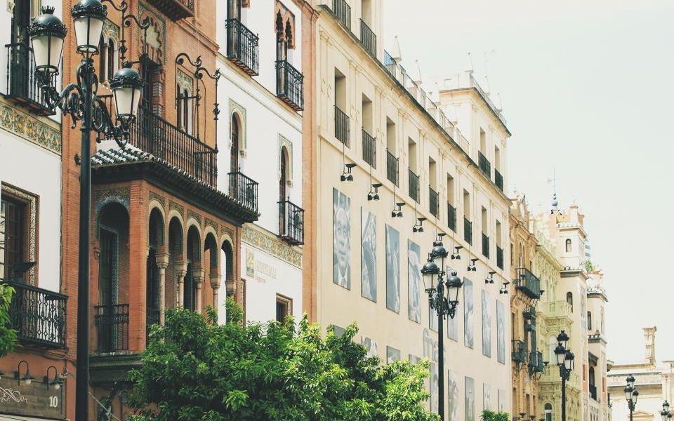 A sunlit street in a Spanish city
